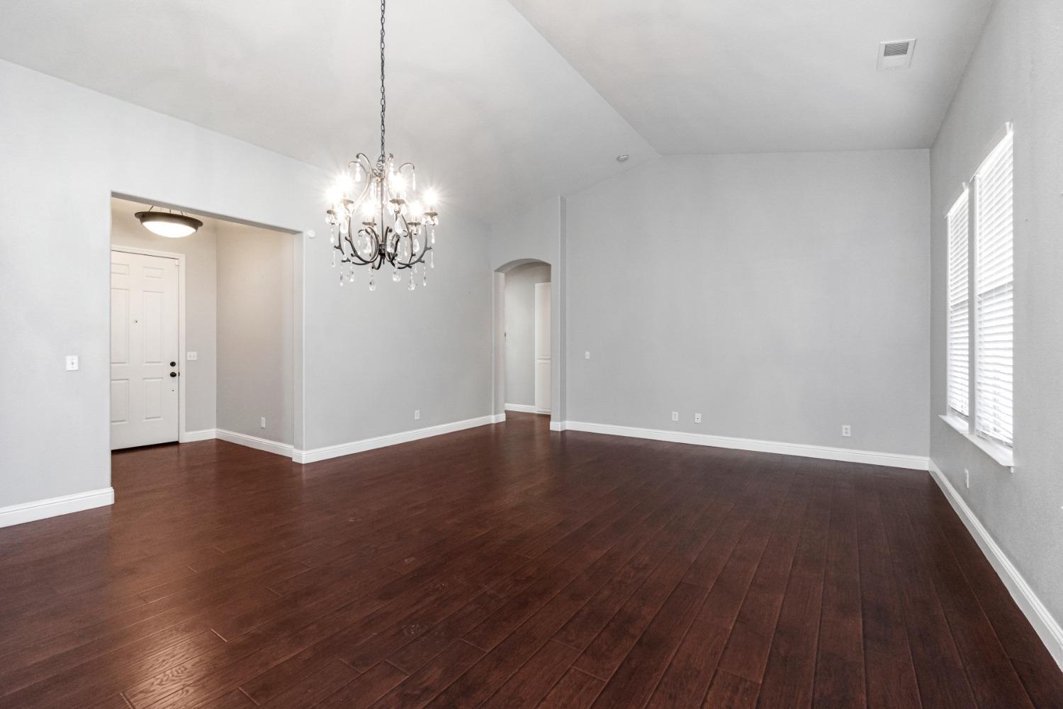 3307 Buckingham Avenue Clovis, CA 93619 - Photo 6 of 32 wooden floor in an empty room with a window