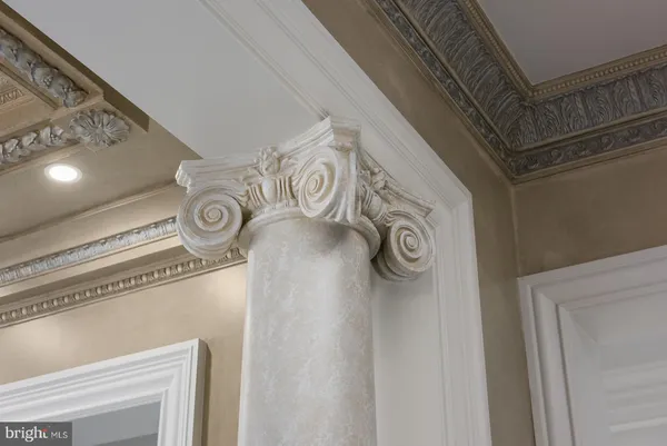 a view of kitchen with refrigerator and window