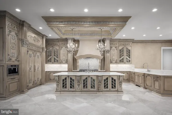 a kitchen with a sink and a refrigerator