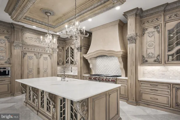 a view of a hallway with chandelier and entryway