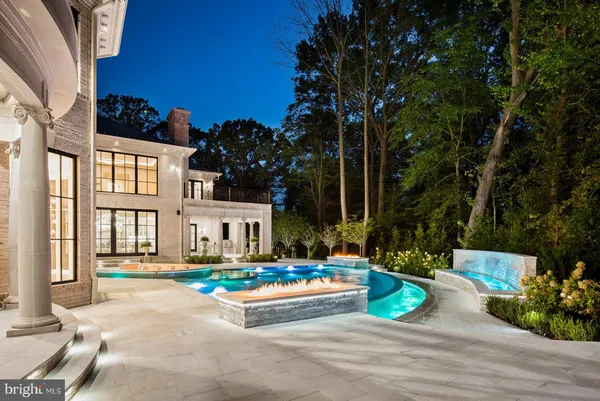 a view of a living room and chandelier