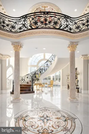 a bathroom with a sink a mirror and painting on the wall