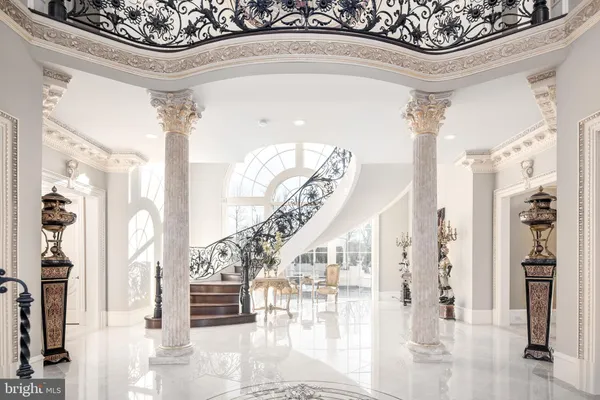 a living room with hardwood floor and a large window