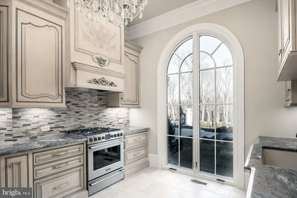 a bathroom with a sink mirror and a shower