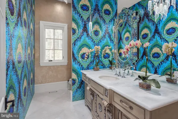 a bathroom with a sink a mirror and a shower