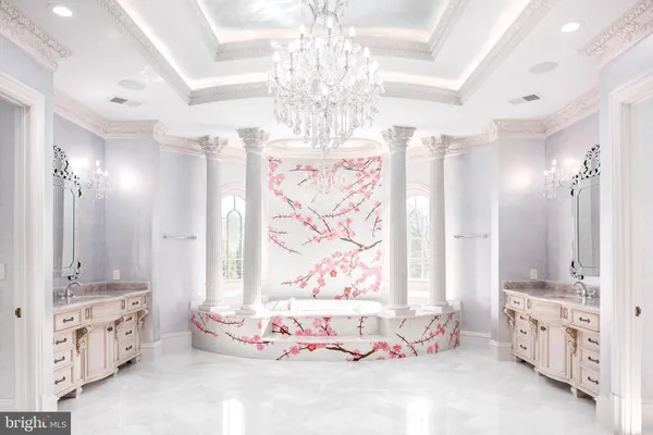 a view of a livingroom with a fireplace and window