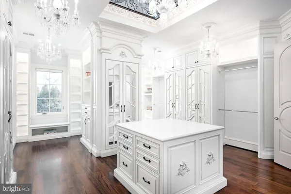 a living room with fireplace furniture and a rug