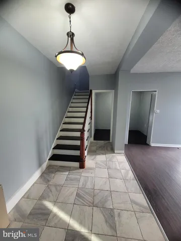 a view of entryway with stairs