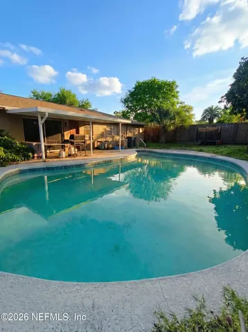 a view of a swimming pool with a patio