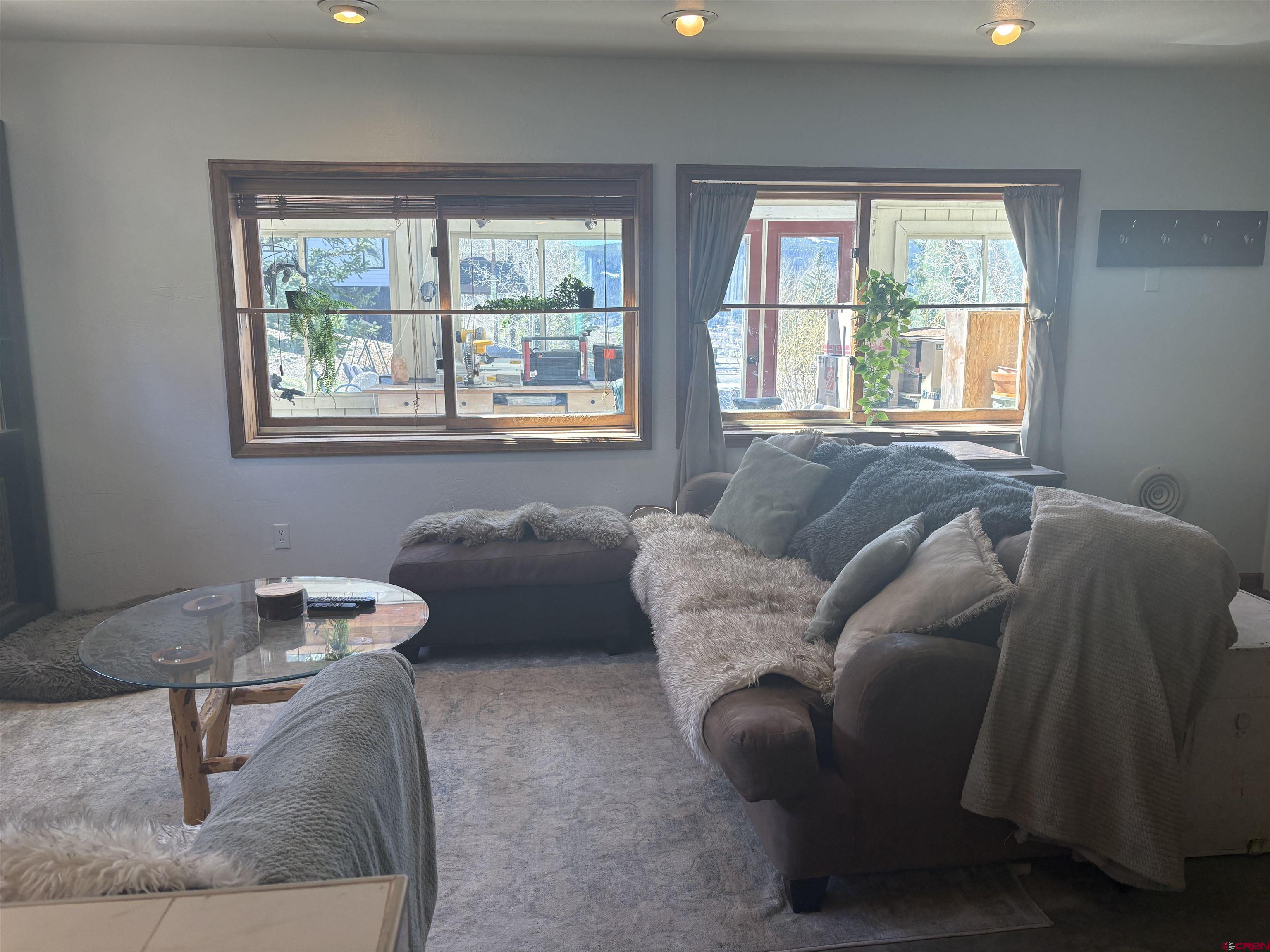 26 Castle Road, Unit 3 Crested Butte, CO 81225 - Photo 17 of 32 a living room with furniture and a window