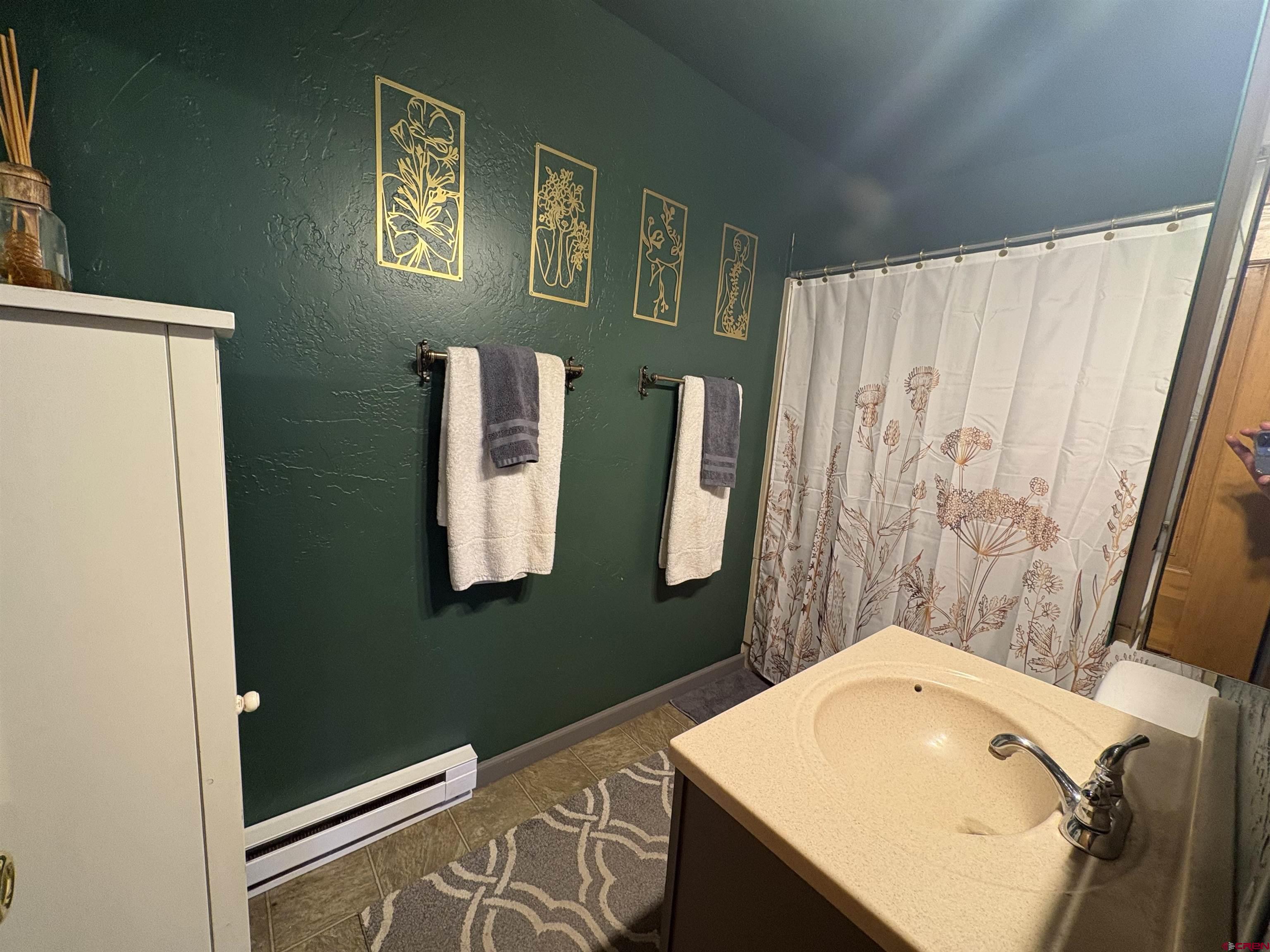 26 Castle Road, Unit 3 Crested Butte, CO 81225 - Photo 19 of 32 a bathroom with a sink and a mirror