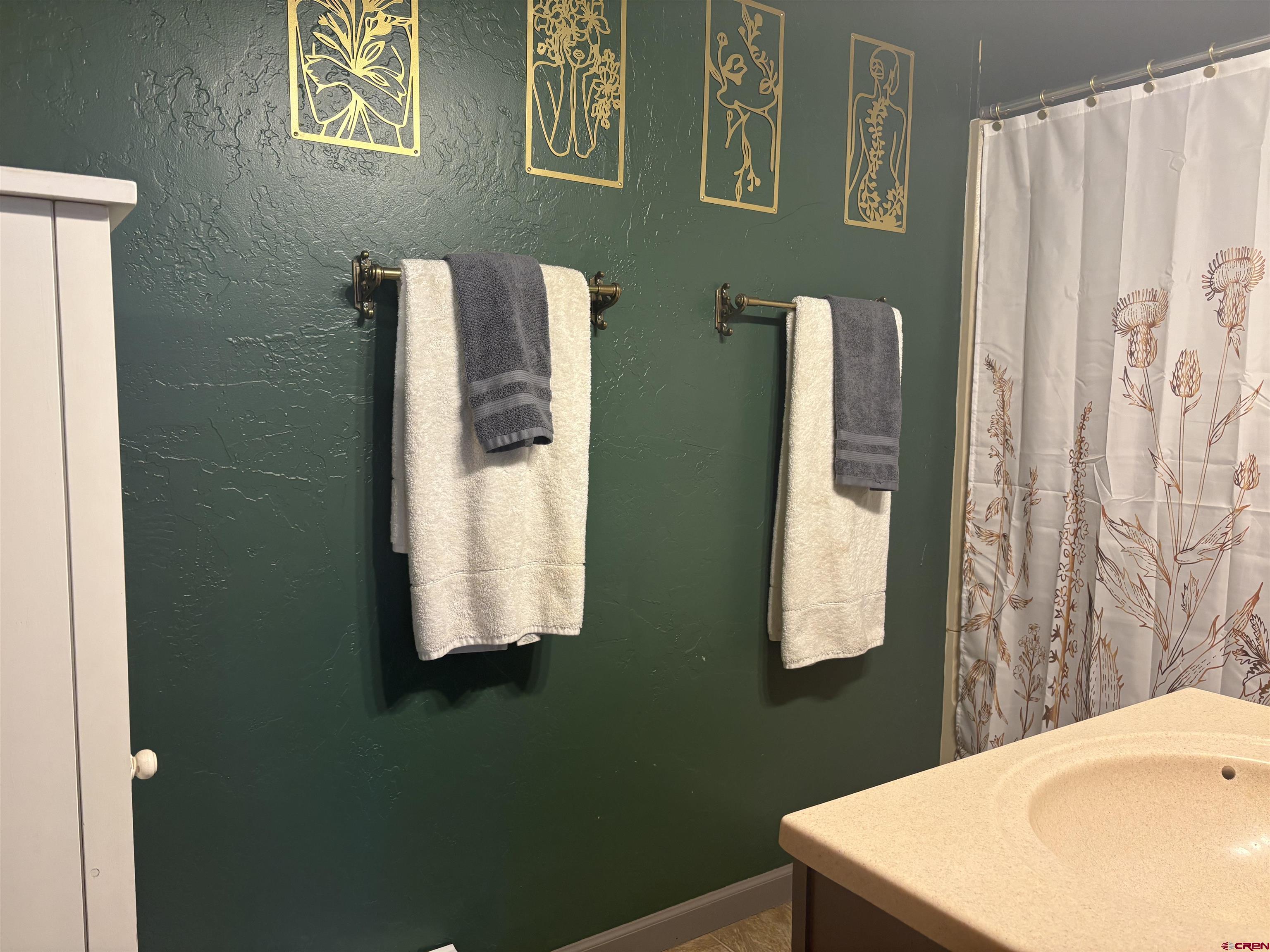 26 Castle Road, Unit 3 Crested Butte, CO 81225 - Photo 21 of 32 a bathroom with a sink toilet and a mirror