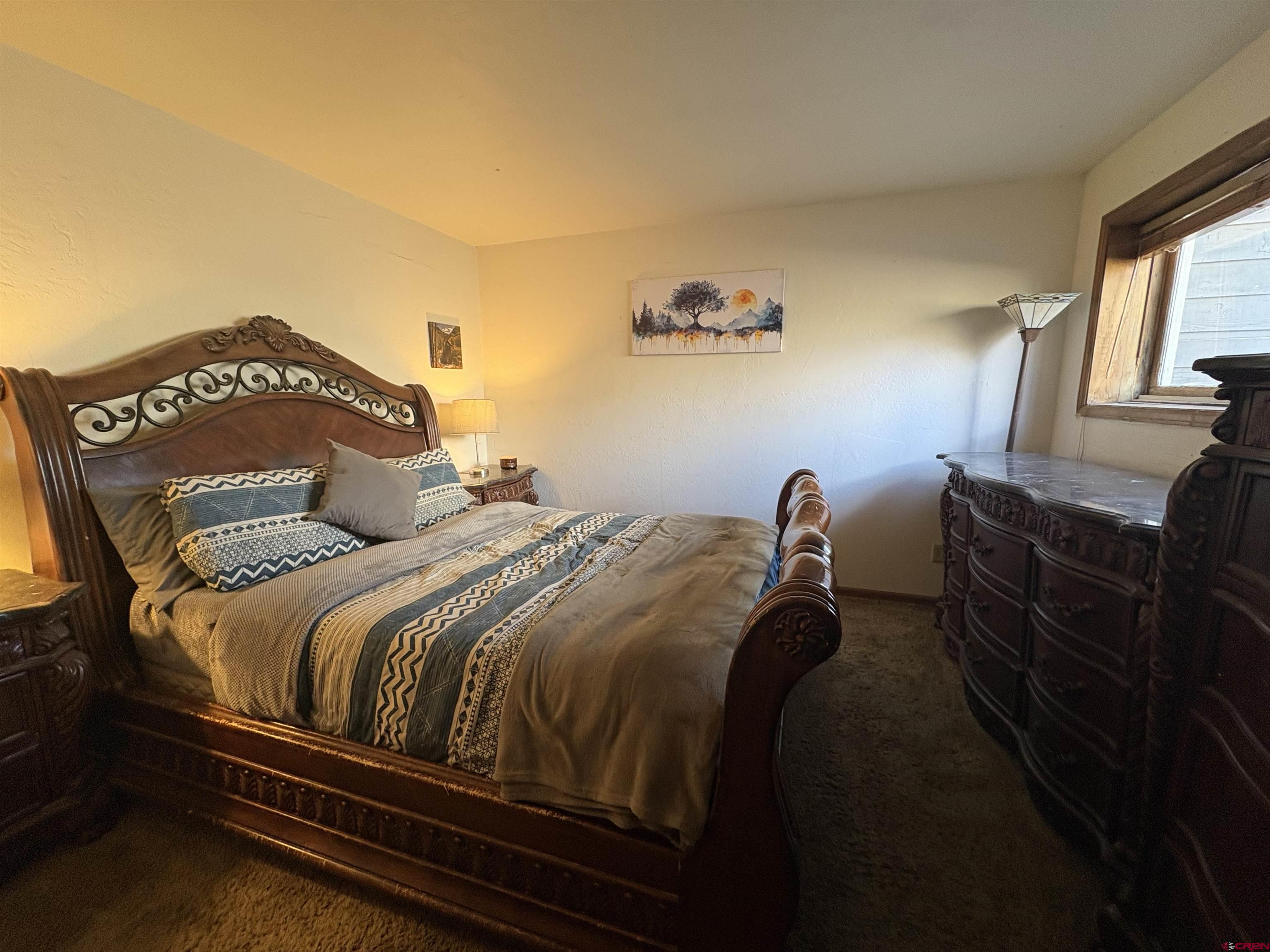 26 Castle Road, Unit 3 Crested Butte, CO 81225 - Photo 22 of 32 a bedroom with a bed and a window