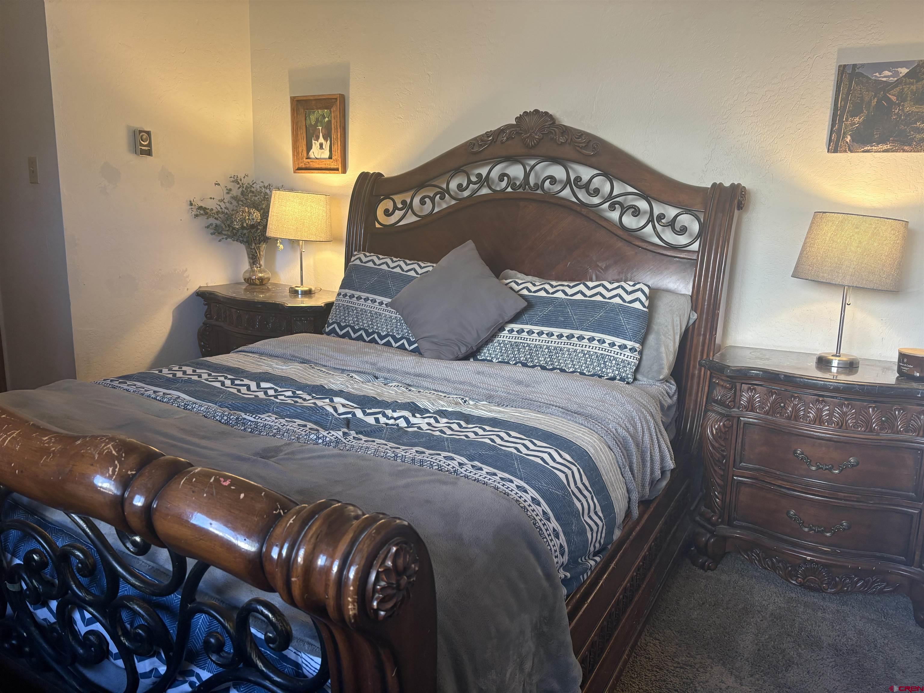 26 Castle Road, Unit 3 Crested Butte, CO 81225 - Photo 23 of 32 a bedroom with a bed and lamp