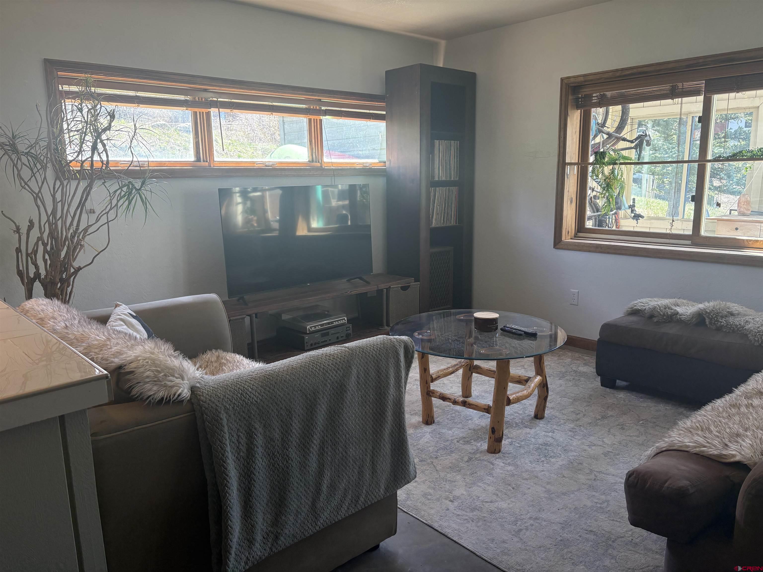 26 Castle Road, Unit 3 Crested Butte, CO 81225 - Photo 8 of 32 a living room with furniture and a window