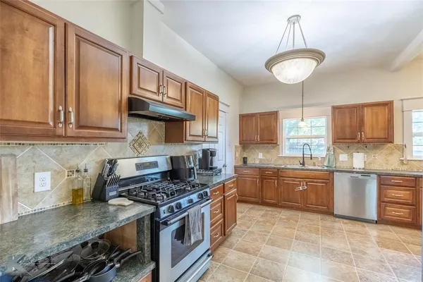 a bathroom with a bathtub and a sink