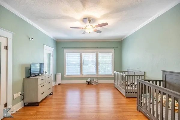 a front view of a house with yard patio and green space