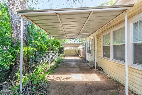 a view of a house with yard and sitting area