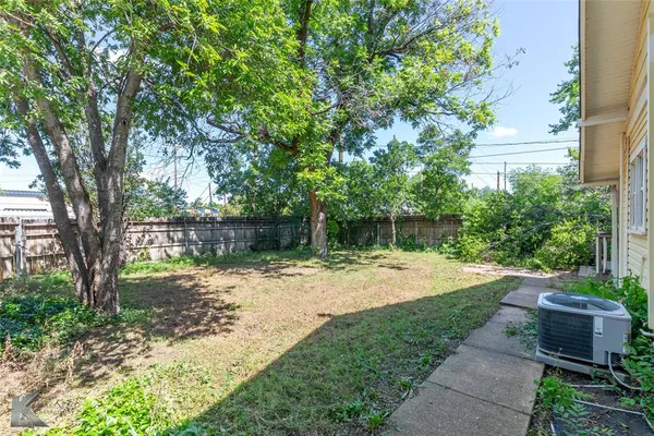 a view of balcony with fireplace and wooden floor
