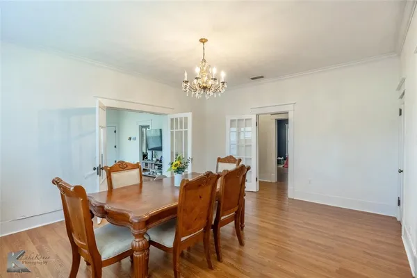 a large kitchen with kitchen island a sink stainless steel appliances and cabinets