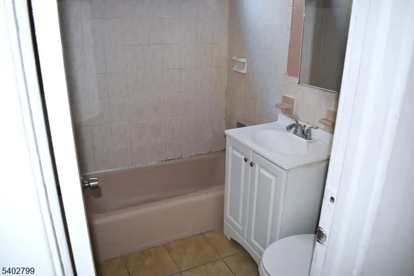 a bathroom with sink shower and bathtub