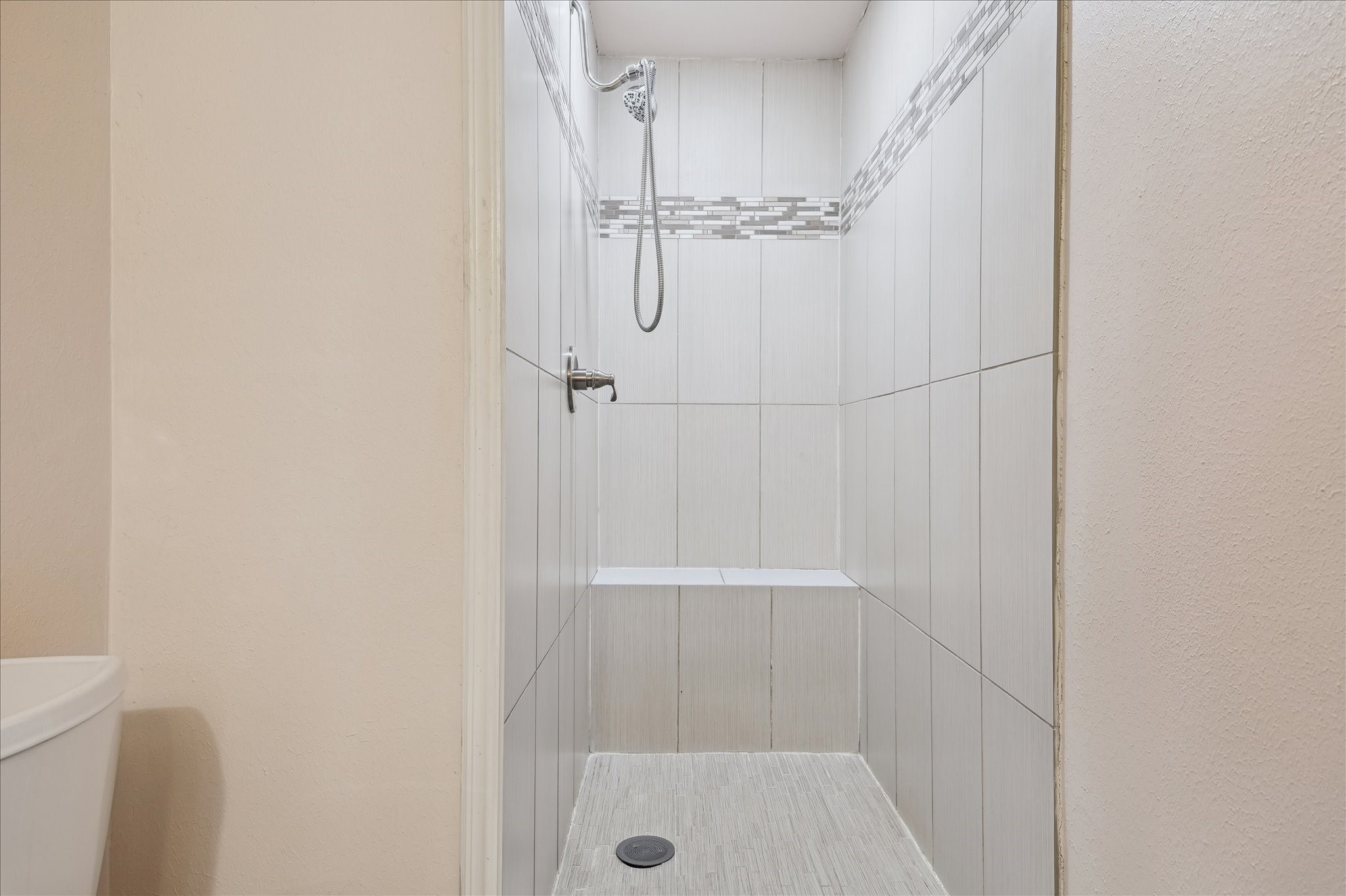 11519 Endicott Lane Houston, TX 77035 - Photo 14 of 25 a bathroom with a glass shower door