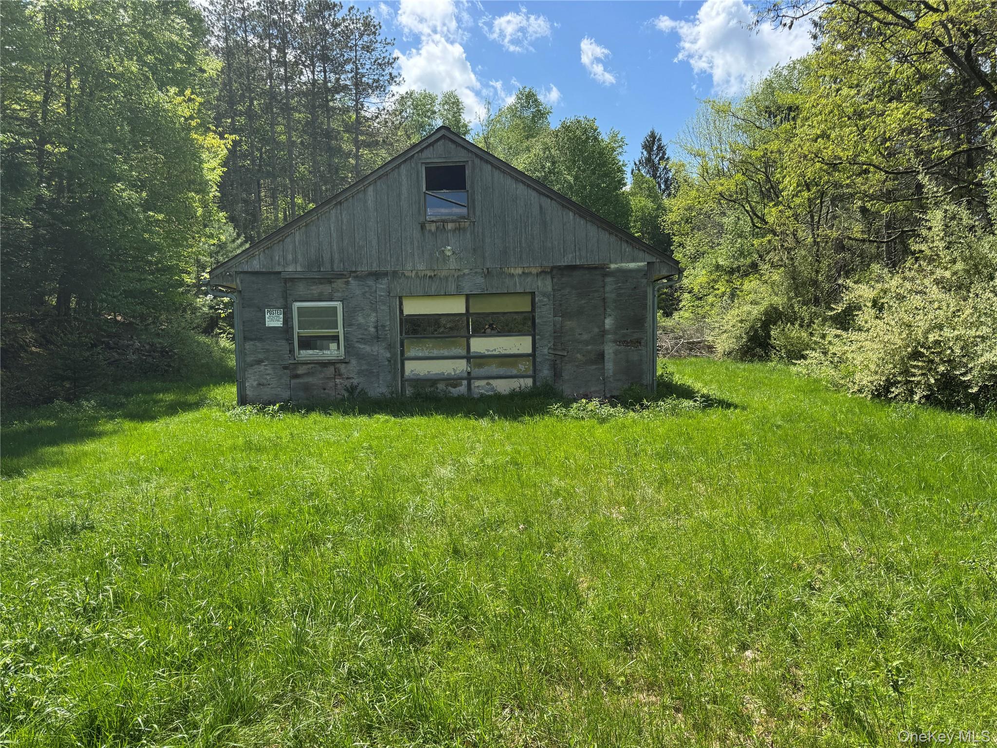 632 New Turnpike Road Cochecton, NY 12726 - Photo 11 of 28 a view of a back yard of the house