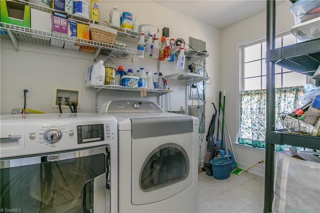 6052 David Moore Road Elon, NC 27244 - Photo 14 of 30 10' x 6.7' laundry with upper shelves for storage