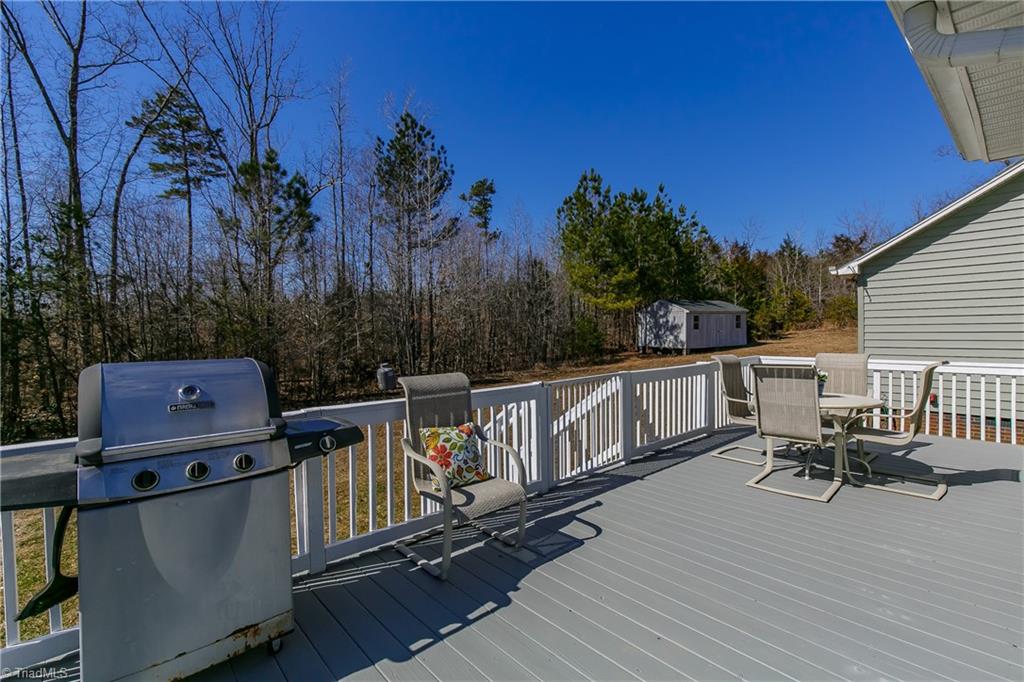 6052 David Moore Road Elon, NC 27244 - Photo 20 of 30 SPECTACULAR wrap around deck covers 3 sides of the home