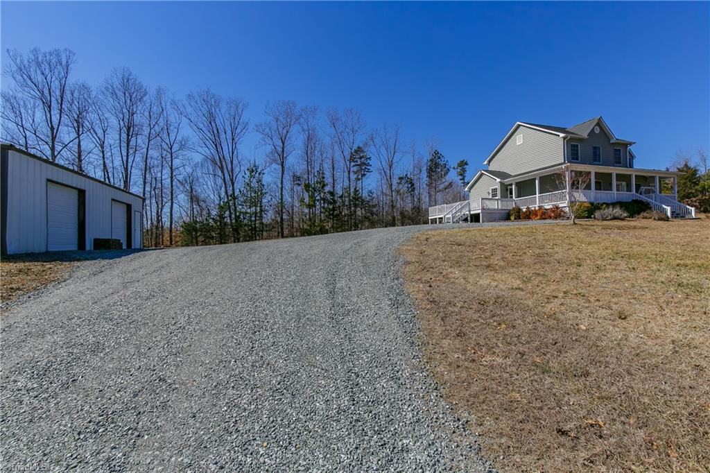6052 David Moore Road Elon, NC 27244 - Photo 3 of 30 Long winding drive leads to detached 2 car garage