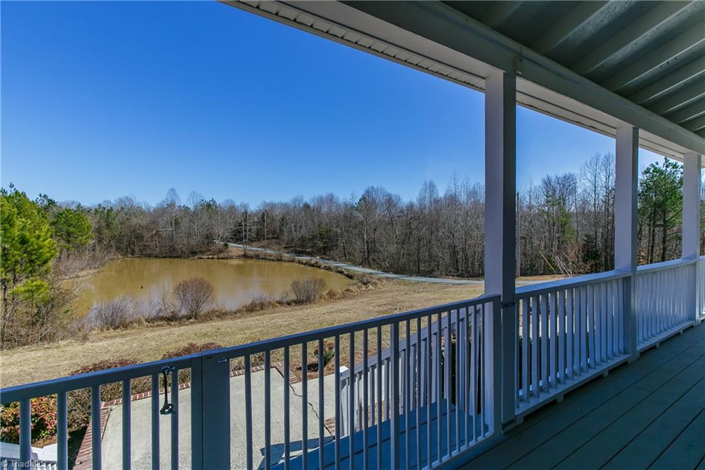 6052 David Moore Road Elon, NC 27244 - Photo 22 of 30 UNIQUE porch gate has 2 openings - smaller one to enter porch the larger one opens and hooks to create an enclosed doggie "run" for your sweet pets