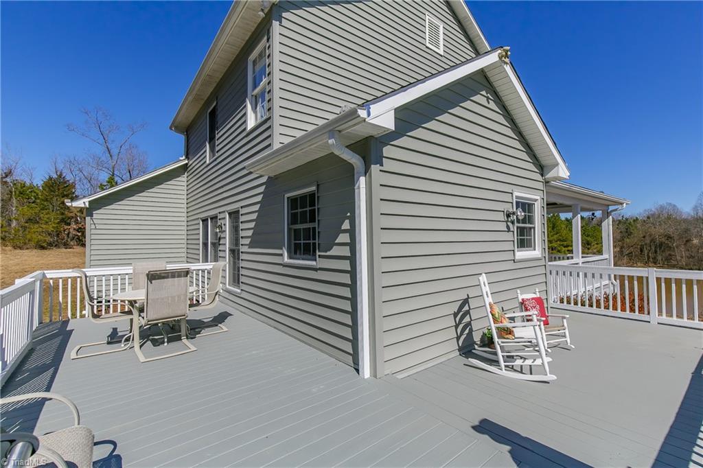 6052 David Moore Road Elon, NC 27244 - Photo 23 of 30 28.7' x 9.6' rear porch/deck area