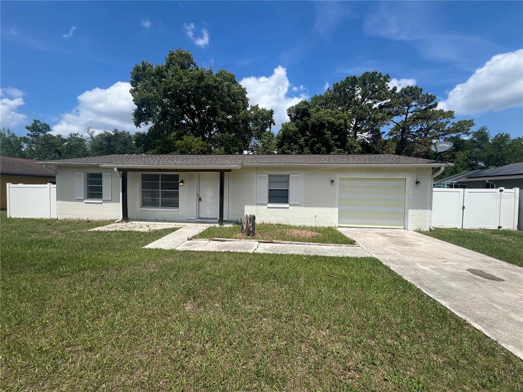 14646 Southwest 43rd Court Road Ocala, FL 34473 - Photo 1 of 1 a backyard of a house with table and chairs