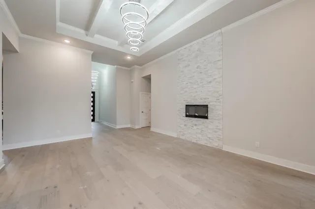 a kitchen with kitchen island white cabinets and stainless steel appliances
