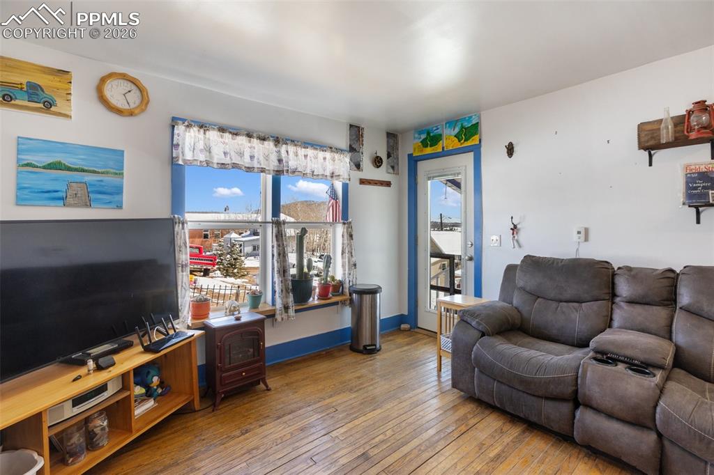 209 5th Street Victor, CO 80860 - Photo 13 of 36 a living room with furniture and a flat screen tv