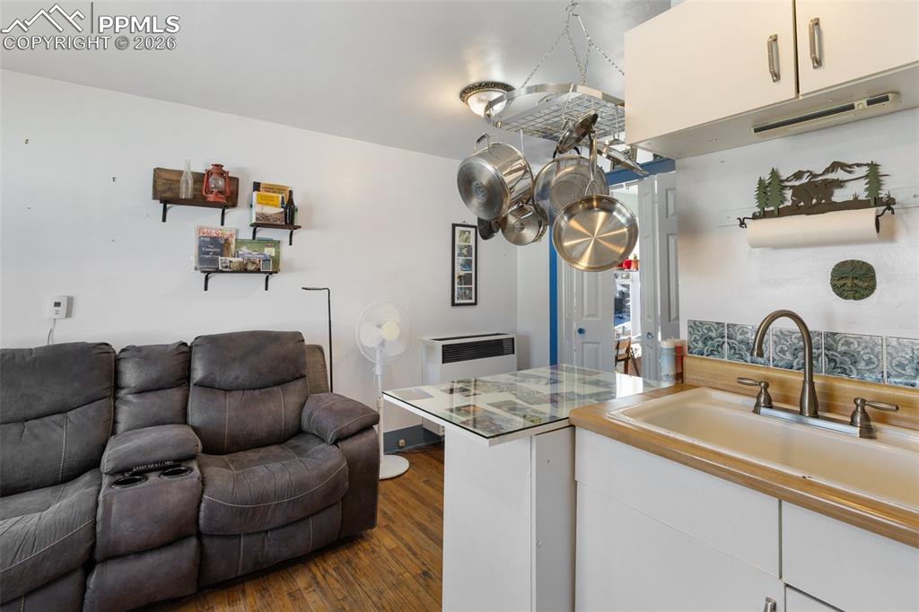 209 5th Street Victor, CO 80860 - Photo 15 of 36 a living room with furniture flowerpot and a mirror