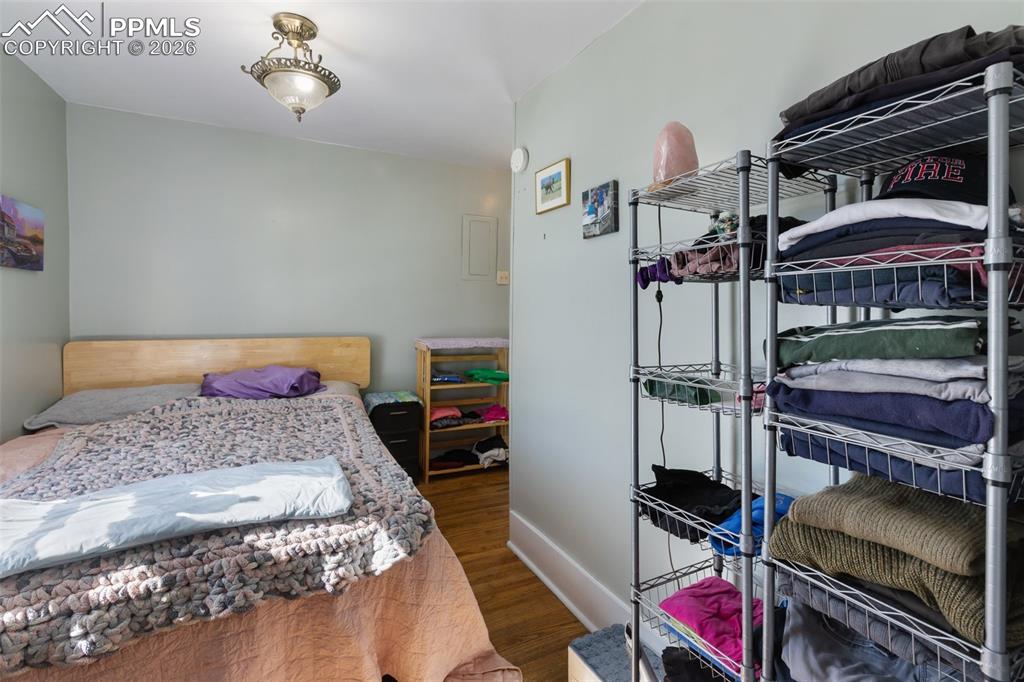 209 5th Street Victor, CO 80860 - Photo 18 of 36 a bedroom with a bed and a dresser