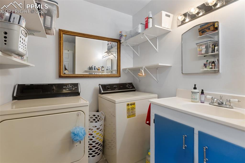 209 5th Street Victor, CO 80860 - Photo 22 of 36 a utility room with dryer and washer