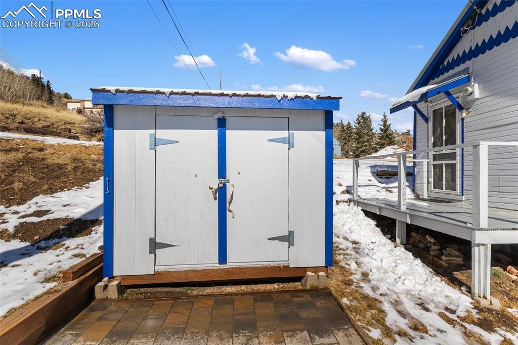 209 5th Street Victor, CO 80860 - Photo 27 of 36 a view of a house with a wooden deck