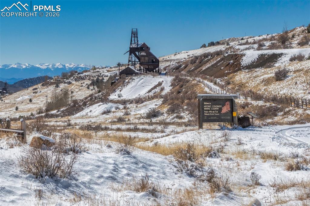 209 5th Street Victor, CO 80860 - Photo 28 of 36 a view of a dry yard with a mountain in the background