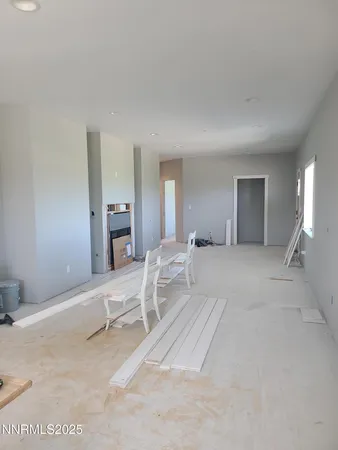 a bedroom with a bed and cabinets
