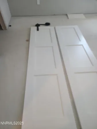 a view of a room that has a large window