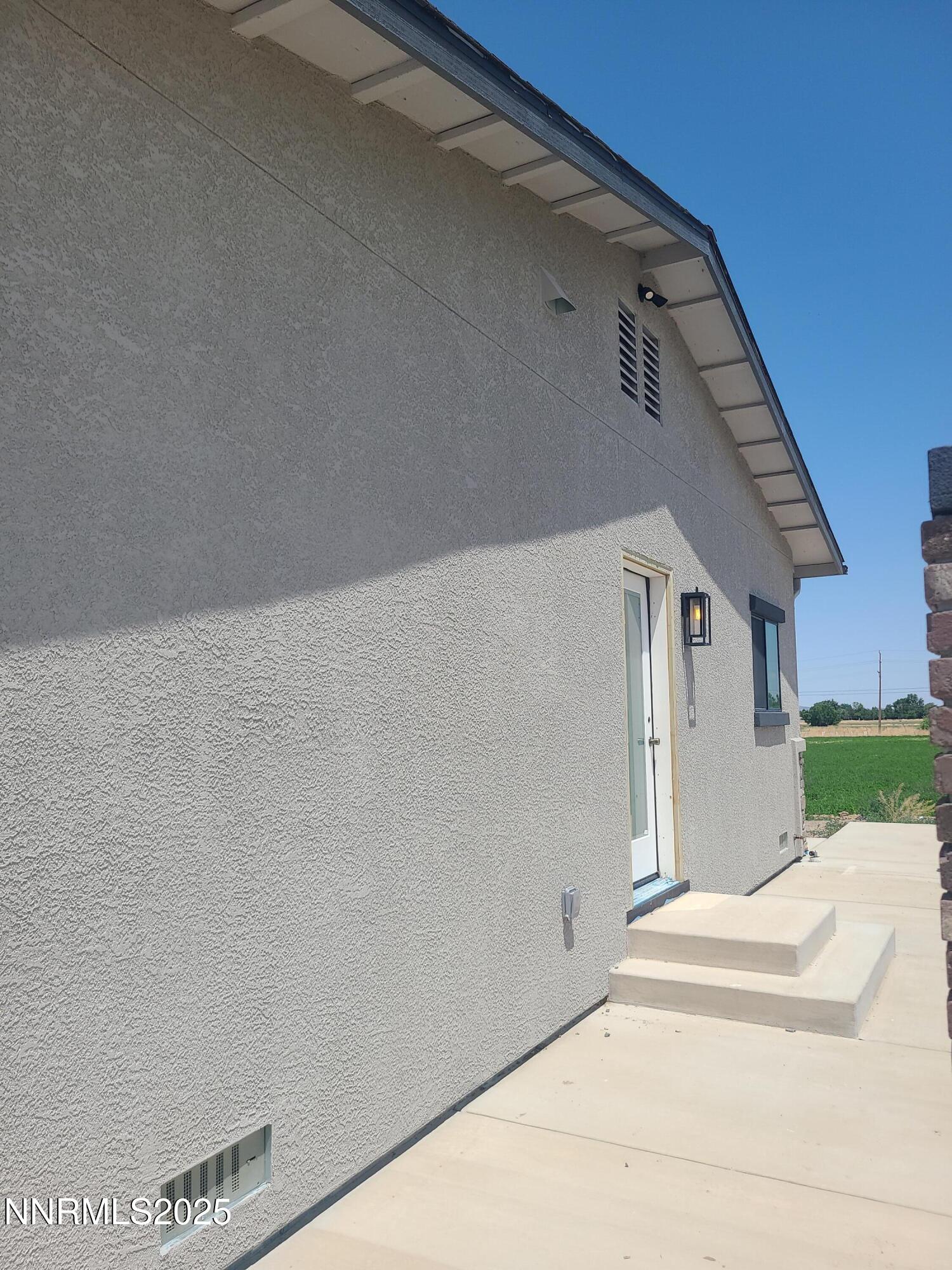 900 Cattle Circle Fernley, NV 89408 - Photo 5 of 21 TOM SIDE OF THE HOUSE TOWARDS COURTYARD