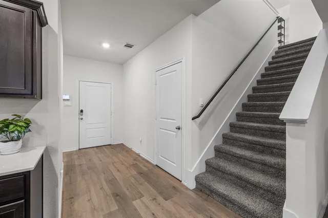 a view of entryway with wooden floor