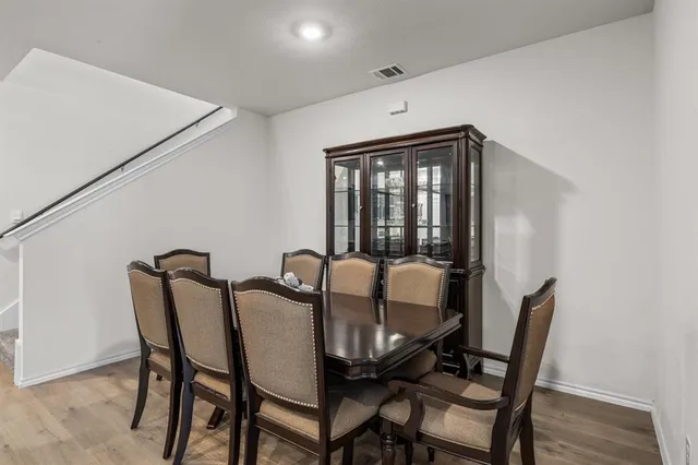 a view of a dining room with furniture and window