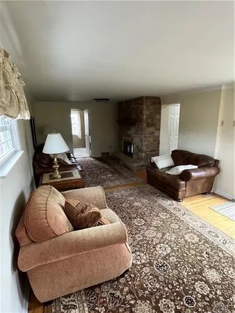a living room with furniture a couch and a fireplace