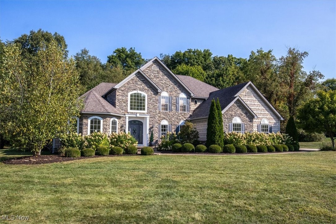 4679 Paxton Road Akron, OH 44321 - Photo 6 of 46 Beautifully landscaped lot of 1.64 acres, with a stone and vinyl shake siding exterior