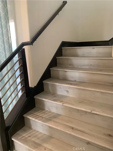 a view of staircase with white walls