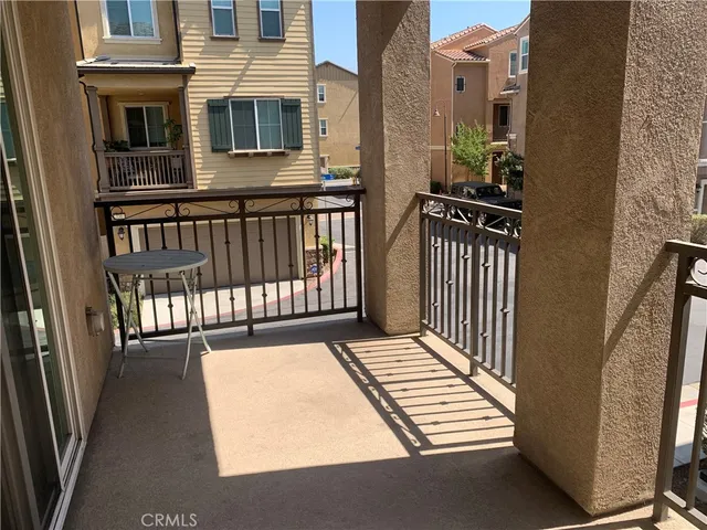 a kitchen with a sink a refrigerator and a microwave