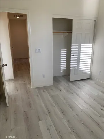 a bathroom with a sink a toilet a mirror and shower curtain